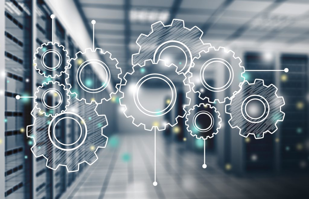 Gears overlaid on a data center representing Project Spectrum CMMC